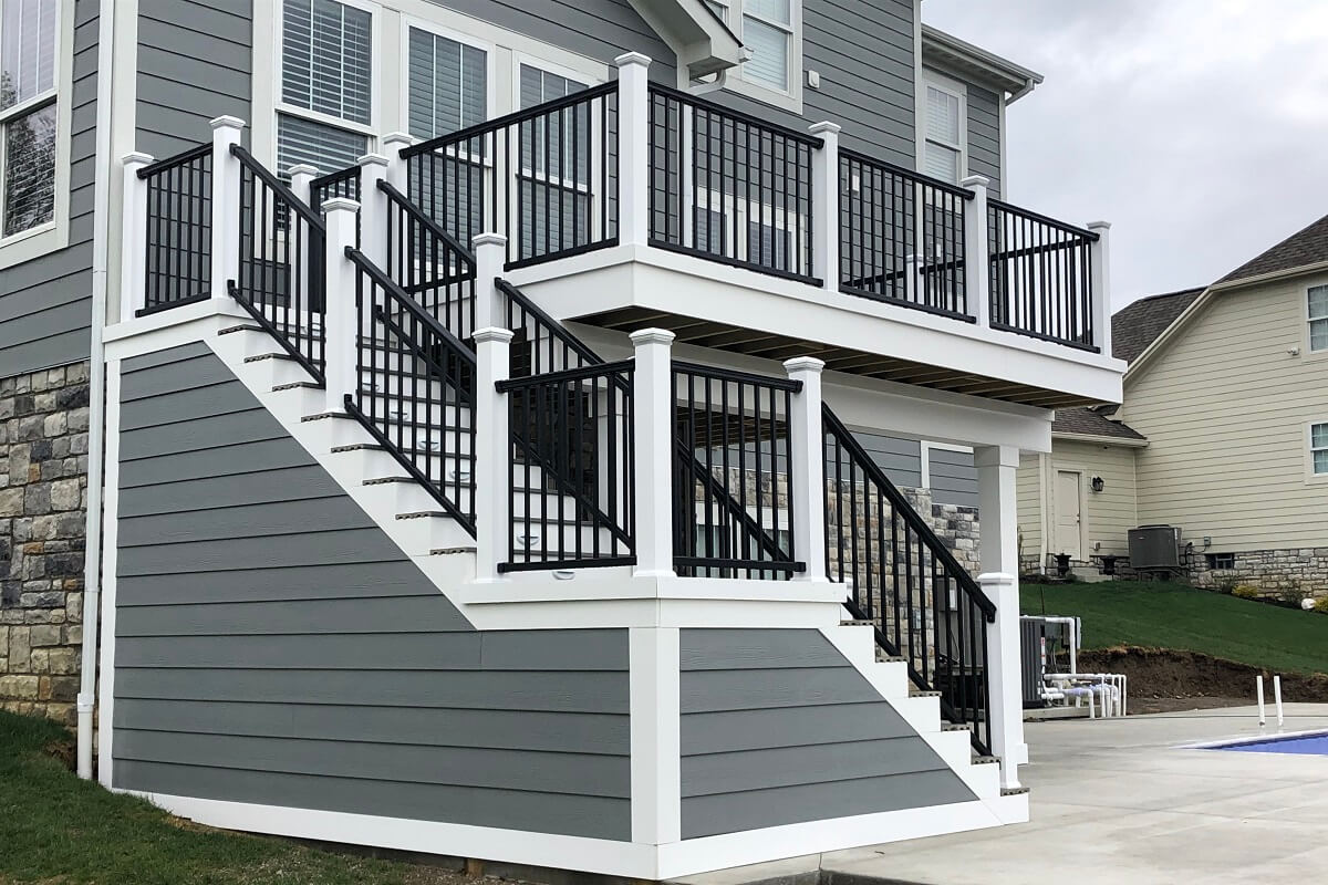 gray and white timber deck with black railing